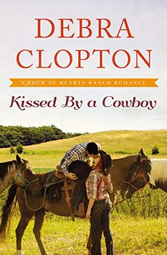 Kissed by a Cowboy (A Four of Hearts Ranch Romance)
